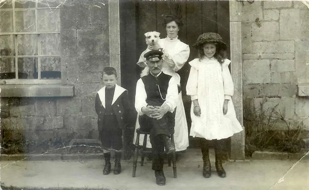 White family in front of 3a Greendown Cottage in Combe Down. Albert White, his second wife Florence, their son Frank. Also Gladys White, from Albert's first marriage to Mary Stennard