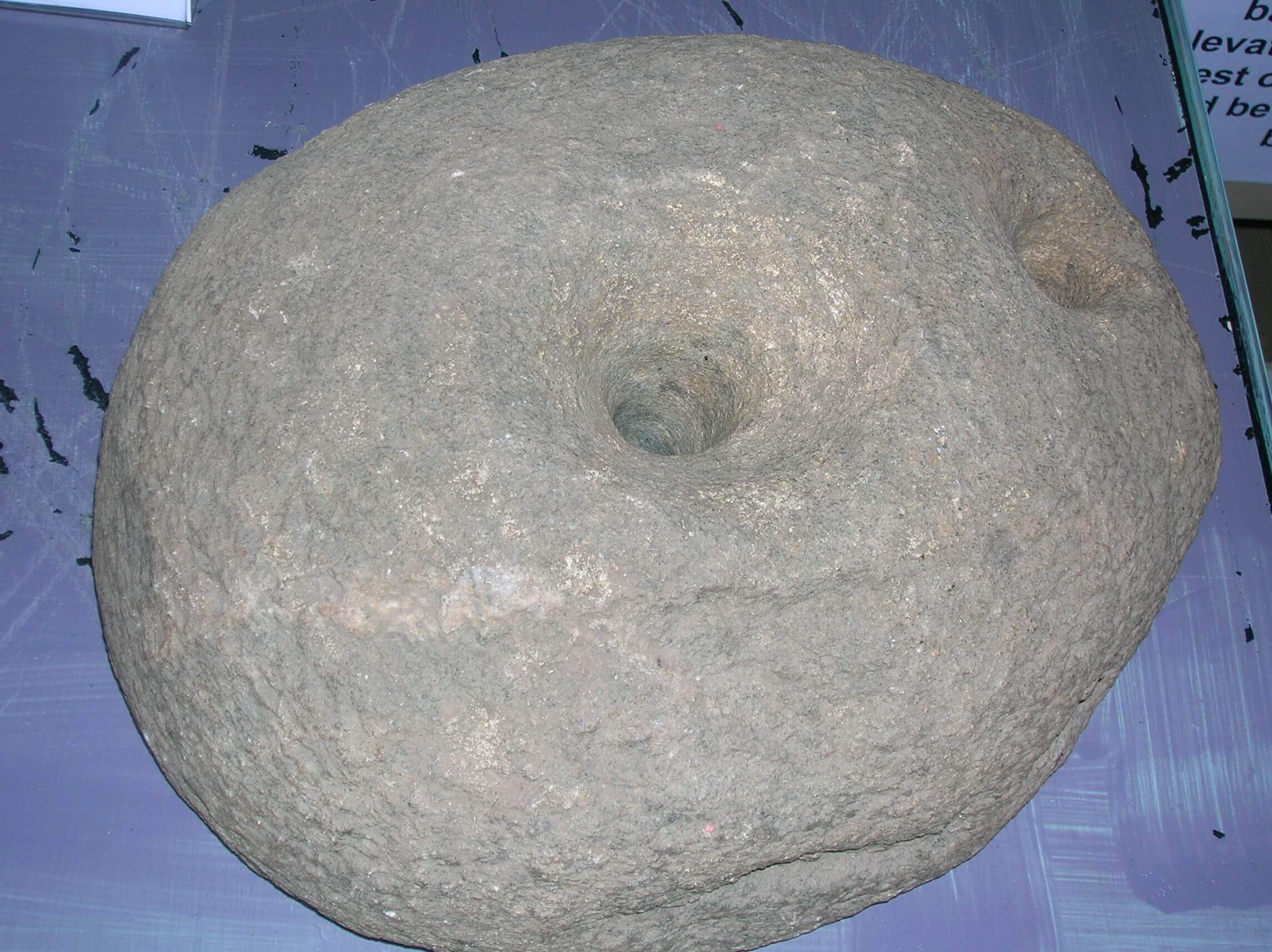 An upper quern stone from Dalgarven Mill. The Ayrshire Museum of Country Life & Costume. North Ayrshire, Scotland