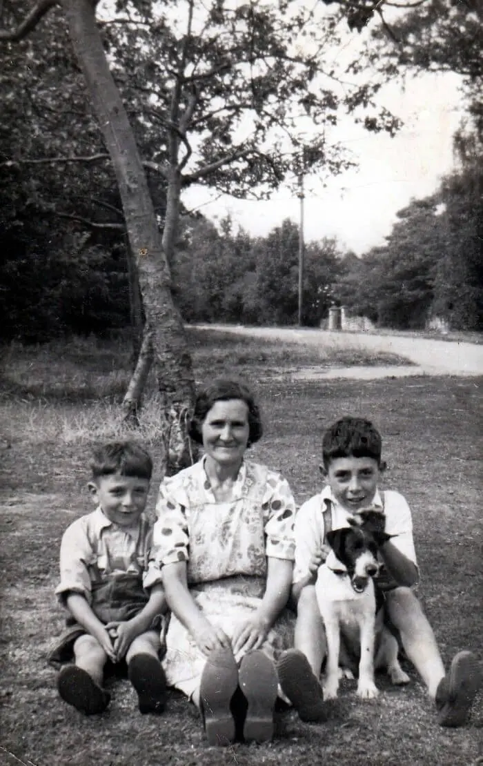 Michael George, Gladys Ivy, Arthur James Miner with Peggy the dog taken outside Bramley Cottages, Claverton Down